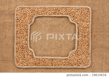 Two frames made of rope with wheat on sackcloth Two frames made of rope with wheat on sackcloth 19614638