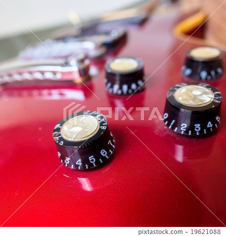 Close up of electric guitar volume knob 19621088