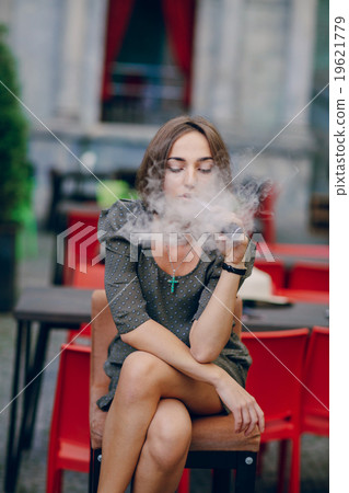 girl with E-cigarette girl with E-cigarette 19621779