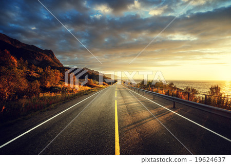road by the sea in sunrise time,  Lofoten island, Norway 19624637