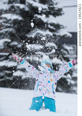 A girl playing with the snow dancing A girl playing with the snow dancing 19624821