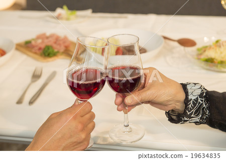 A toast with red wine A toast with red wine 19634835
