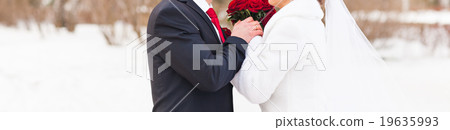 bride and groom in the winter woods bride and groom in the winter woods 19635993
