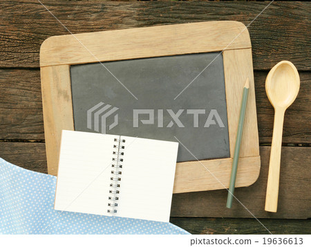 The slate chalkboard and wooden spoon 19636613
