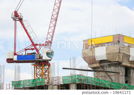 Crane working building in city on sky. 19641171
