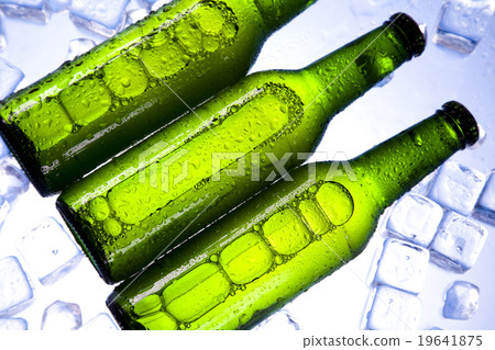 Beer is in ice, bright vibrant alcohol theme Beer is in ice, bright vibrant alcohol theme 19641875