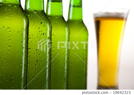Beer bottle and glass, bright vibrant alcohol  19642323