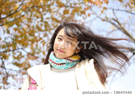 Autumn leaves and young women Autumn leaves and young women 19645440