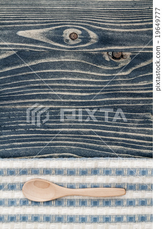 Wooden Spoon on Napkin and Blue Wooden Background Wooden Spoon on Napkin and Blue Wooden Background 19649777