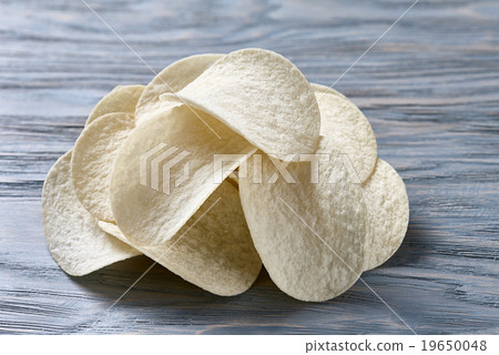 Potato chips on blue Potato chips on blue 19650048