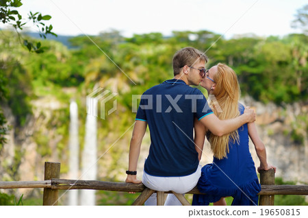 Young couple enjoying a view on Chamarel falls 19650815