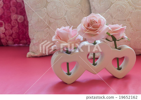 Artificial pink rose flower in heart shape vase Artificial pink rose flower in heart shape vase 19652162