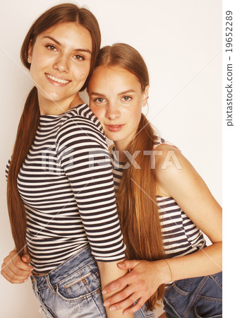 two cute teenagers having fun together isolated on 19652289