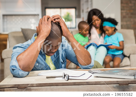 Man with bills and calculator  19655582