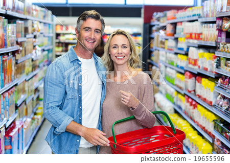 Smiling couple posing for camera Smiling couple posing for camera 19655596