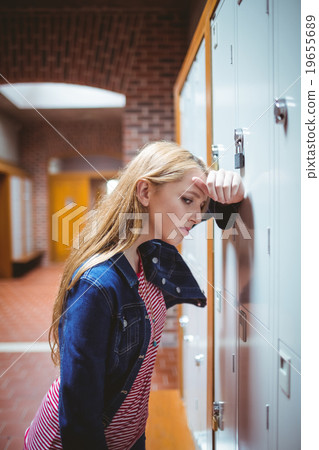 Worried leaning against the locker Worried leaning against the locker 19655689