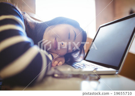 Sleeping student in lecture hall 19655710