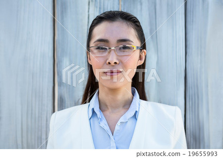 Portrait of smiling businesswoman with take-away coffee 19655993