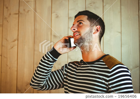 Casual hipster using his phone Casual hipster using his phone 19656406