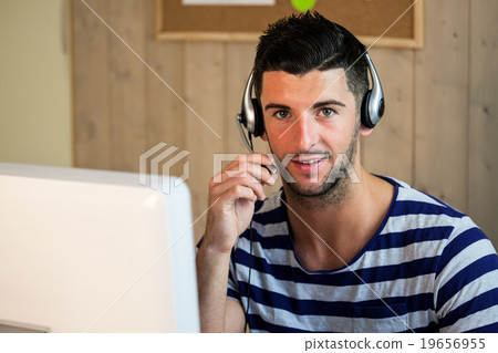 Handsome hipster using his tablet pc 19656955