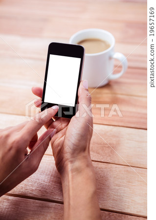 Feminine hand using smartphone 19657169