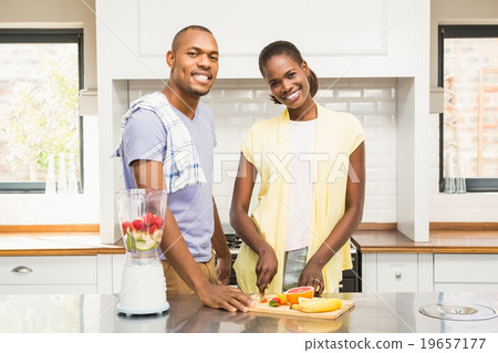 Young casual couple making fruits Young casual couple making fruits 19657177