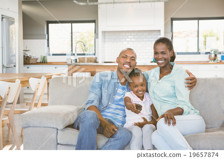 Happy family relaxing on the couch Happy family relaxing on the couch 19657874