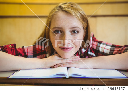 Blonde student smiling at the camera Blonde student smiling at the camera 19658157