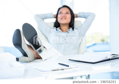 Worried businesswoman in front of her laptop  19658201