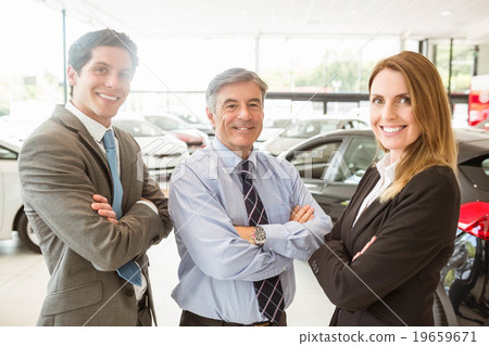 Group of smiling business team standing together 19659671