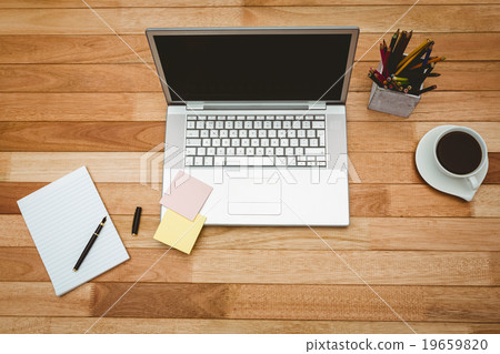 View of a grey laptop with coffee View of a grey laptop with coffee 19659820
