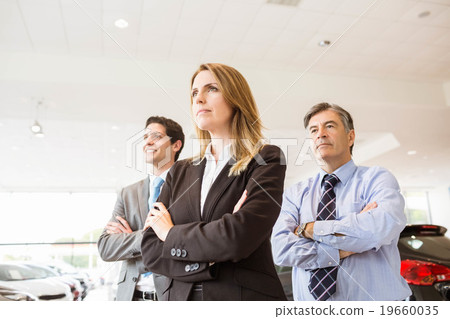 Group of smiling business team standing together Group of smiling business team standing together 19660035