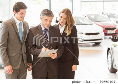 Group of smiling business team standing together Group of smiling business team standing together 19660305