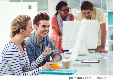 Creative business team working hard together on pc 19660508