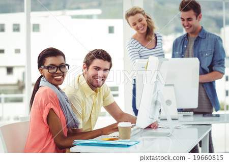 Creative business team working hard together on pc 19660815