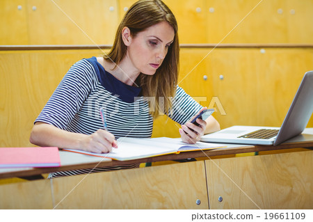 Mature student in lecture hall Mature student in lecture hall 19661109