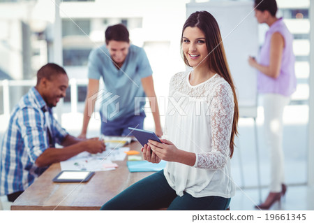 Young creative worker using tablet 19661345