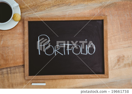 Portfolio against a big blackboard Portfolio against a big blackboard 19661738