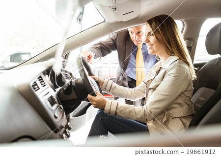 Salesman showing somethings to a customer Salesman showing somethings to a customer 19661912