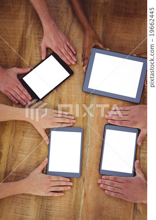 Creative team working together on a tablet and smartphones 19662445