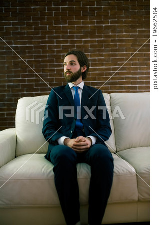 Businessman sitting on the couch 19662584