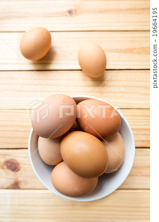 hen eggs in bowl on wood background hen eggs in bowl on wood background 19664195