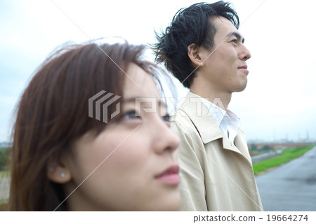 A couple standing in the river 19664274