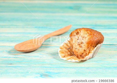 banana cup cake on wood deck . 19666386