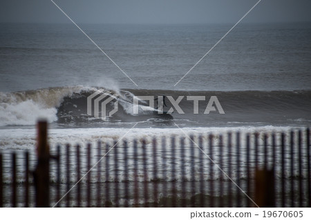 Surfer cruising on a wave Surfer cruising on a wave 19670605