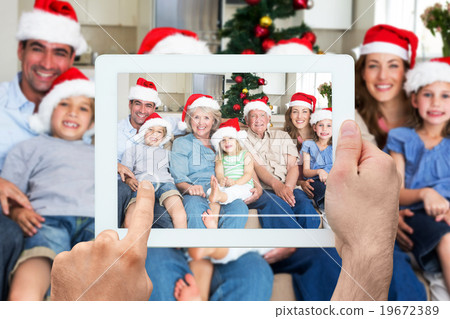 Composite image of hand holding tablet pc 19672389