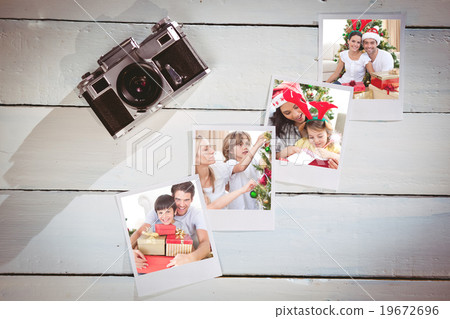 Composite image of happy couple celebrating christmas at home Composite image of happy couple celebrating christmas at home 19672696