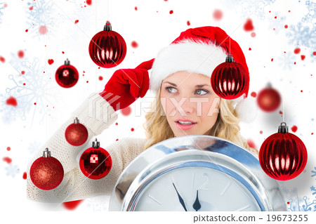 Composite image of happy festive blonde with clock Composite image of happy festive blonde with clock 19673255