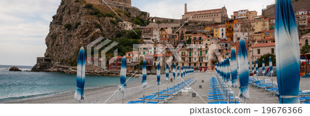 Blue umbrella and beachchair at the beach in Blue umbrella and beachchair at the beach in 19676366