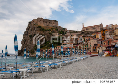 Blue umbrella and beachchair at the beach in Blue umbrella and beachchair at the beach in 19676367